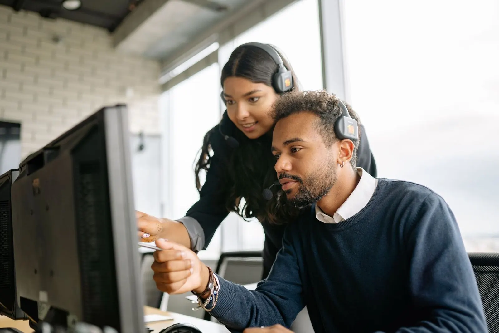 Customer support team handling enquiries at their desks