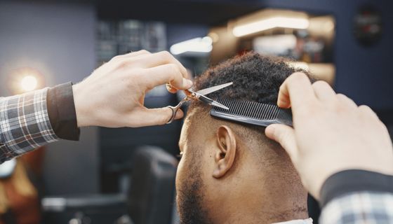 Barber at work — the kind of business we build websites for