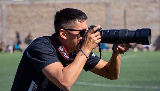 Photographer at work — the kind of business we build websites for