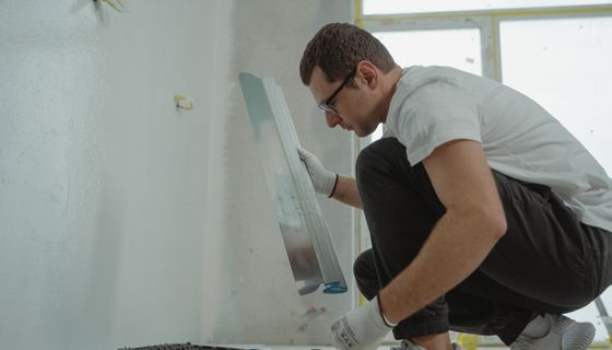 Plasterer at work — the kind of business we build websites for
