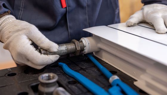 Plumber at work — the kind of business we build websites for