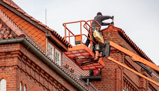 Roofer at work — the kind of business we build websites for